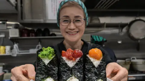 Getty Images Owner of Onigiri Bongo, a shop specialising in rice balls known as "onigiri"