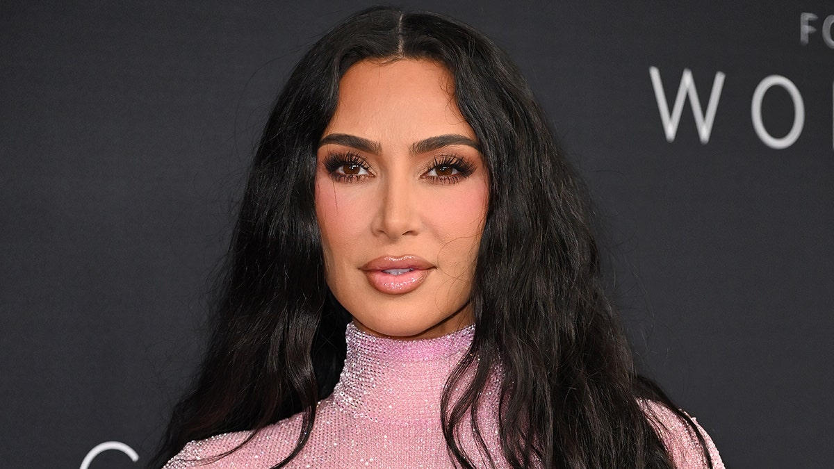 Kim Kardashian walks red carpet wearing pink dress