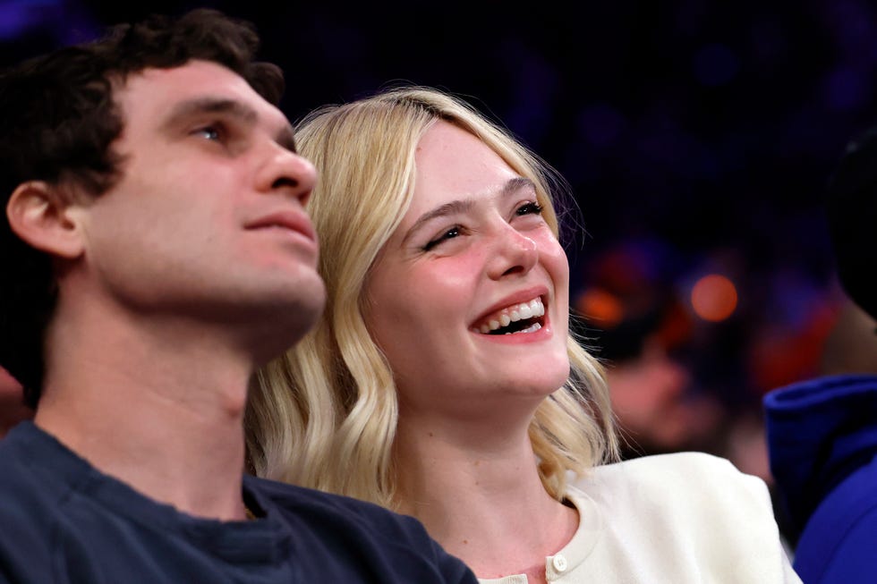 gus wenner and elle fanning at the philadelphia 76ers v new york knicks game