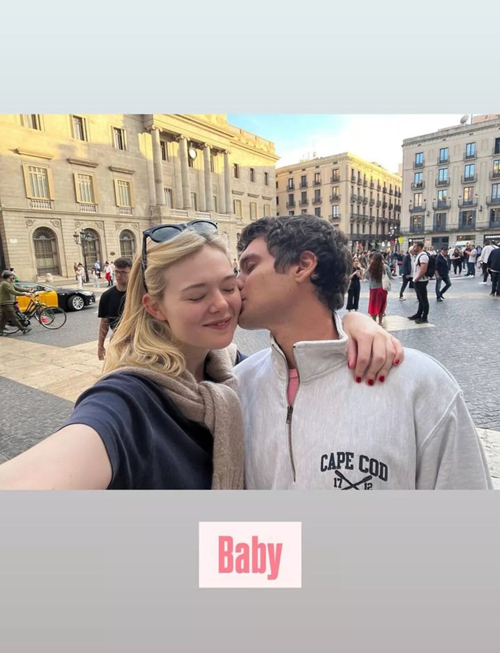 couple taking a selfie in a lively urban area