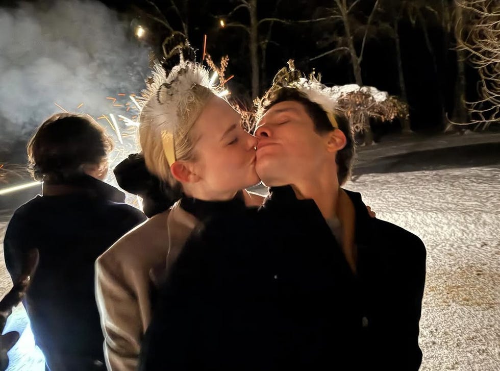 a gathering of individuals celebrating with sparklers in a night setting