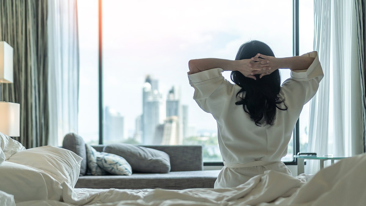 woman waking up in big city