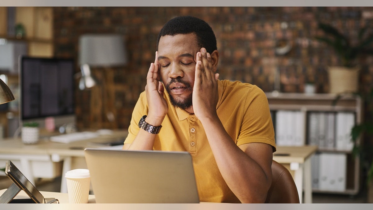 Man anxious headache