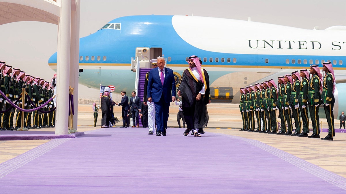 U.S. President Donald Trump walks with Saudi Crown Prince Mohammed Bin Salman during a welcoming ceremony in Riyadh, Saudi Arabia, May 13, 2025. 