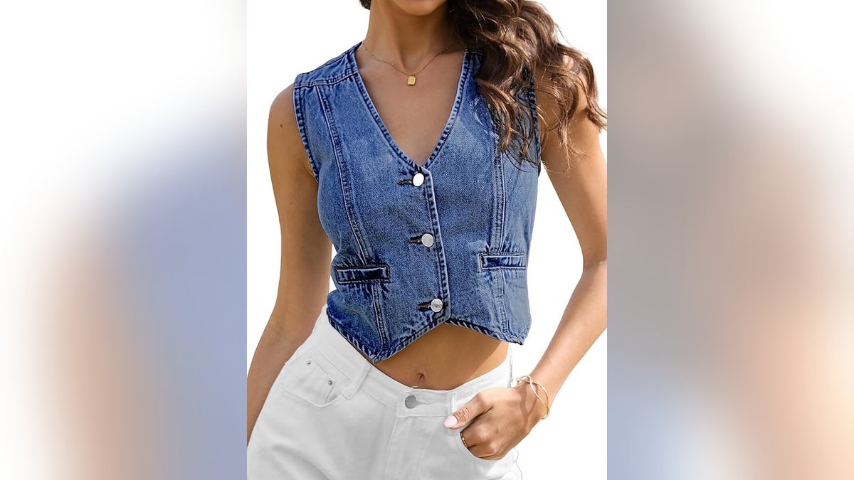 Blue denim vest on a model with white jeans