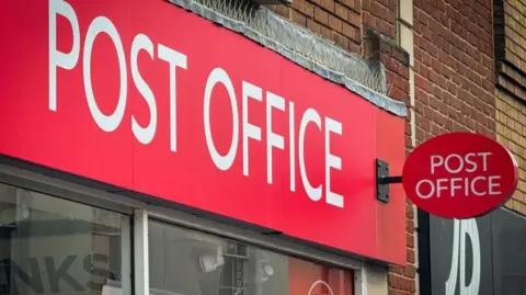 Getty Images The front of a Post Office branch on a High Street