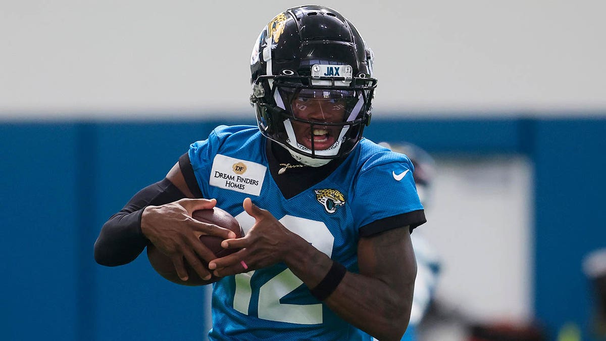 Travis Hunter with the ball