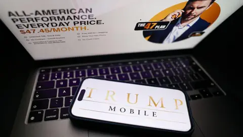 Nur Photo/Getty Images In this photo illustration, the Trump Mobile website displayed on a laptop screen and Trump Mobile logo displayed on a phone screen are seen in Krakow, Poland on June 16, 2025