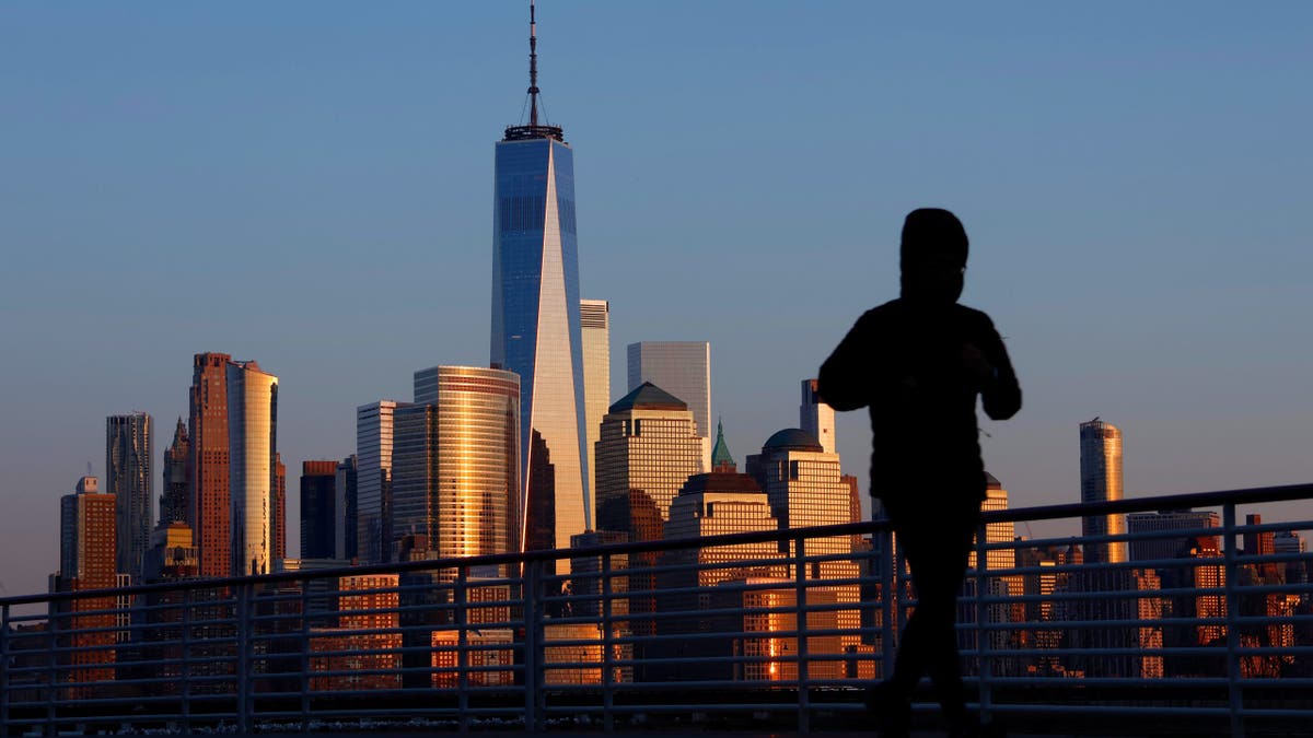 NYC skyline with jogger in foreground
