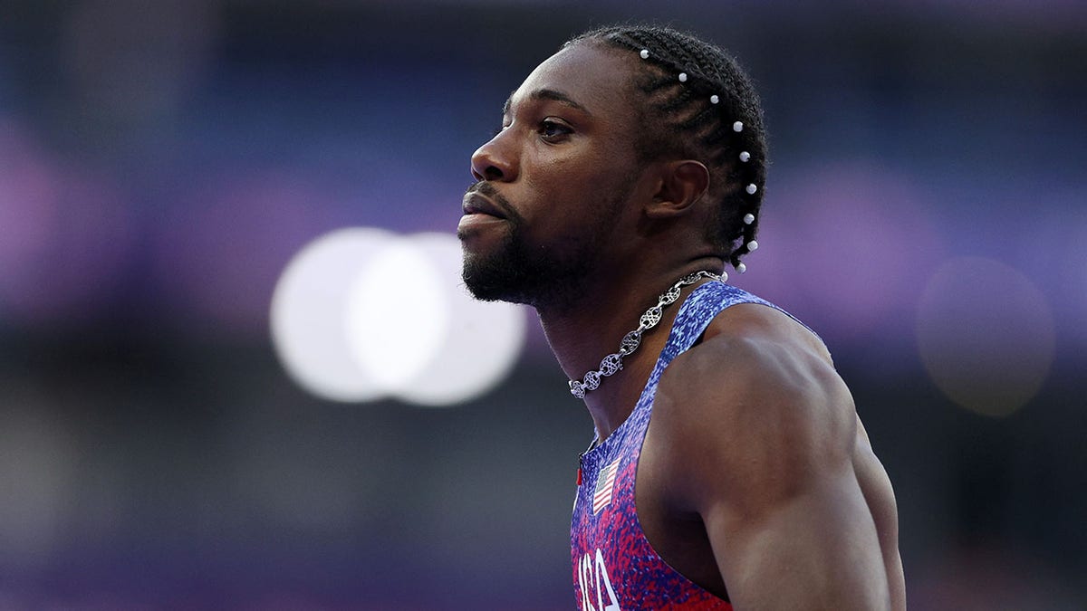 Noah Lyles looks on