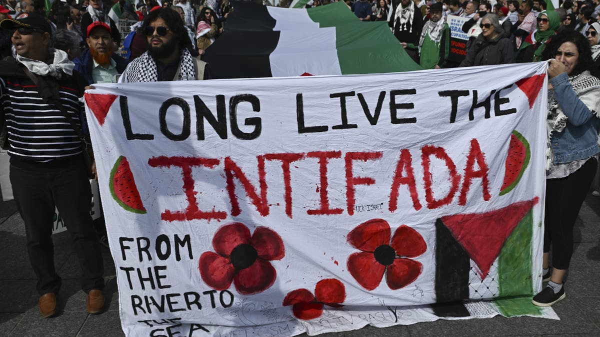 The idea of globalizing the intifada has gone global. Antisemitic protesters holding banners in Alberta, Canada on April 13, 2025.