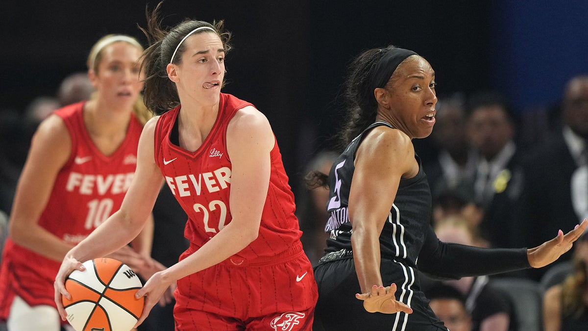 Caitlin Clark looks to pass