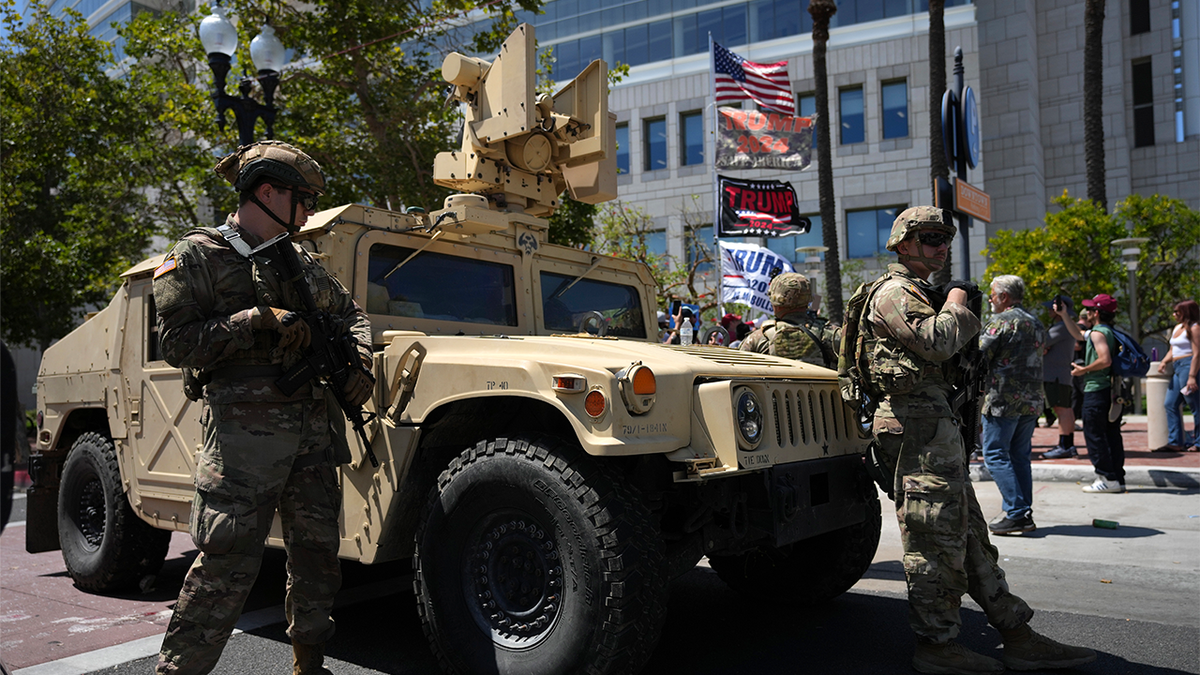 California National Guard stand guard along a street