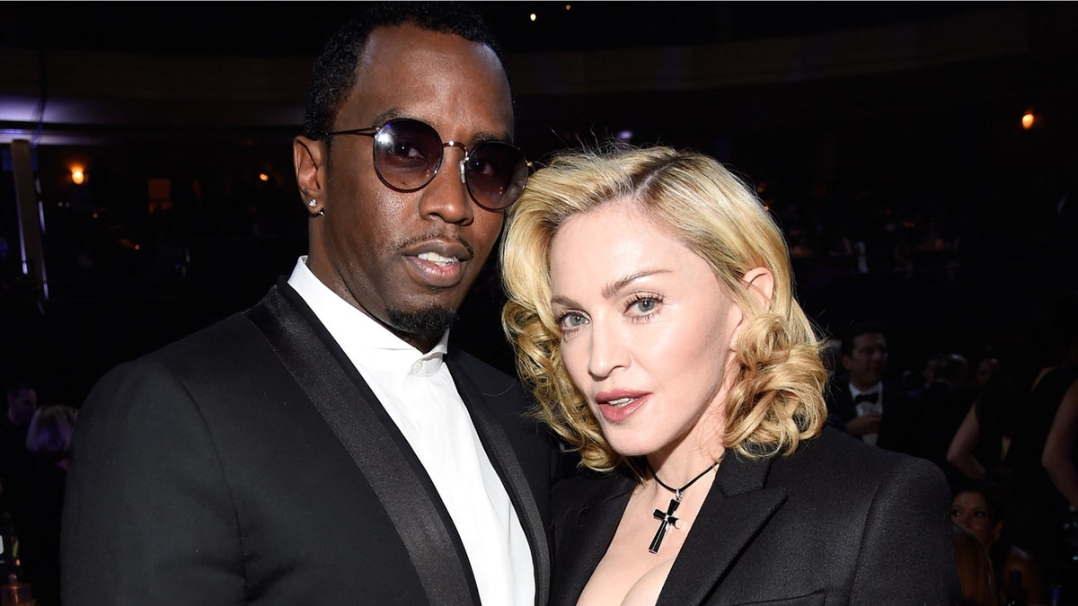 Diddy and Madonna pose for a photo