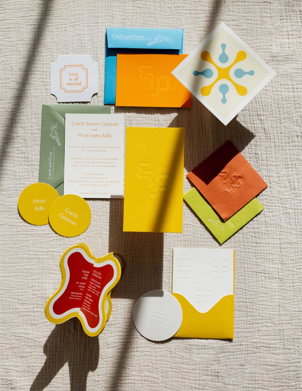collection of colorful wedding invitation cards and related prints