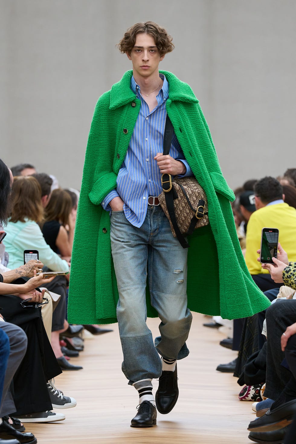 Fashion model showcasing a vibrant outfit on a runway