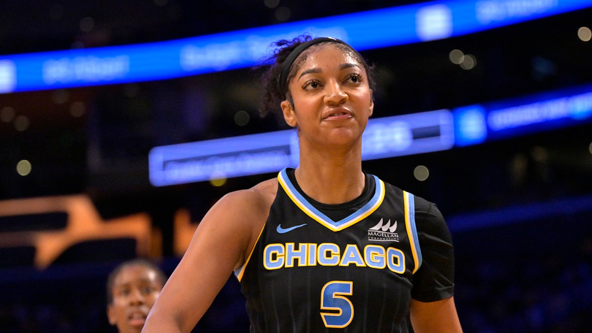 Angel Reese reacts on court