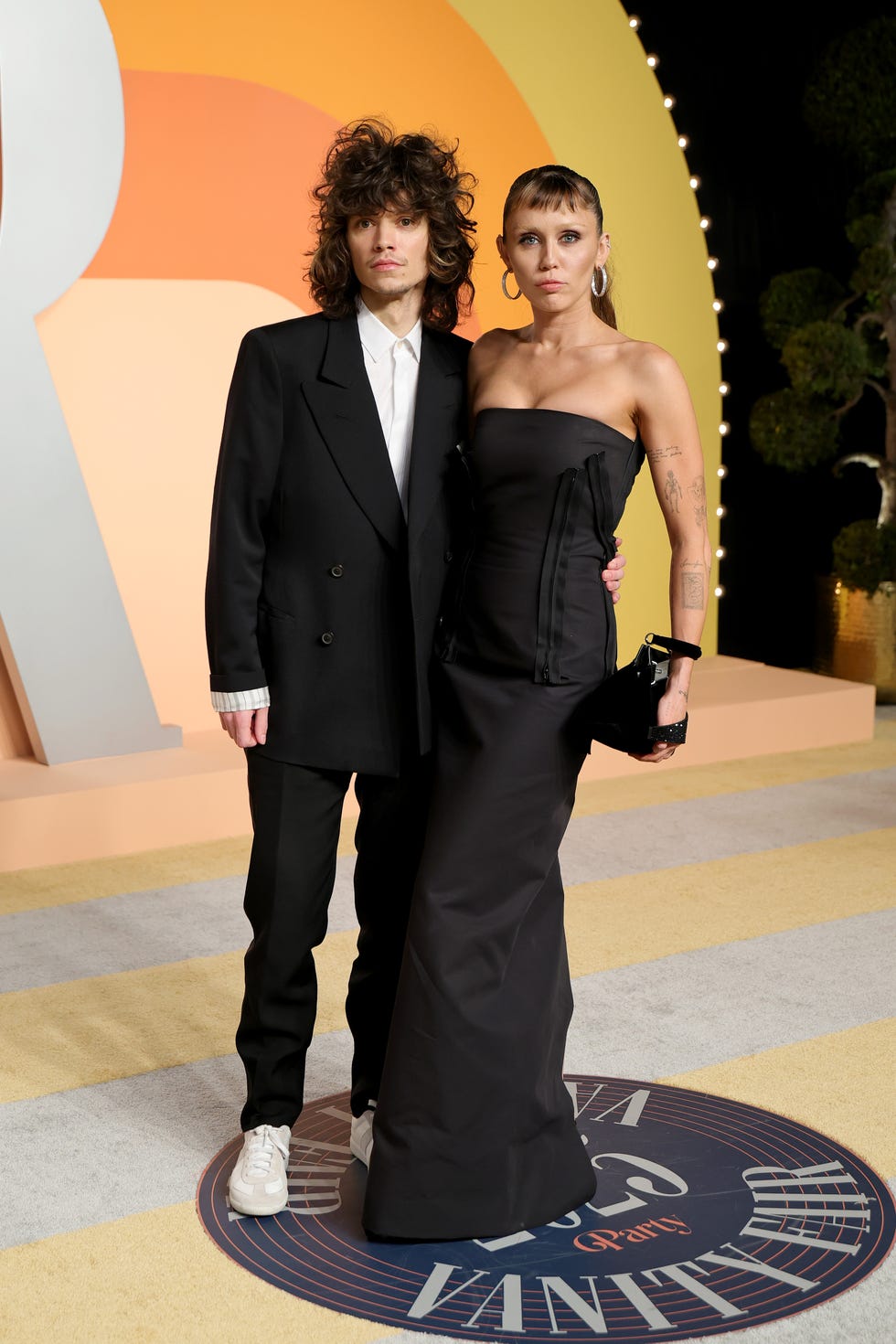 miley cyrus and maxx morando at the vanity fair party