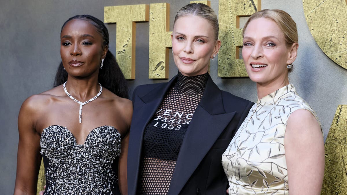 charlize theron with kiki layne and uma thurman on the red carpet