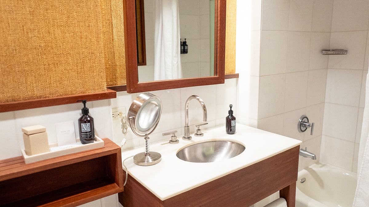 hotel bathroom with sink shown up close