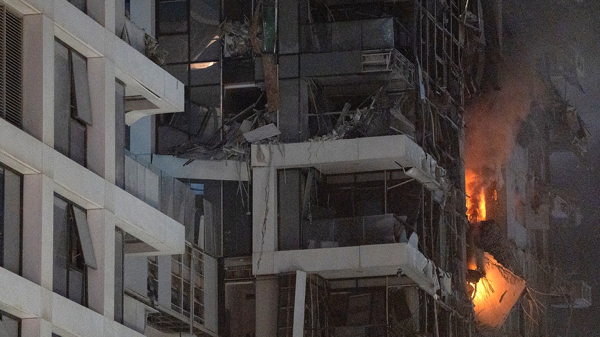 A building on fire in Tel Aviv after an Iranian missile strike.