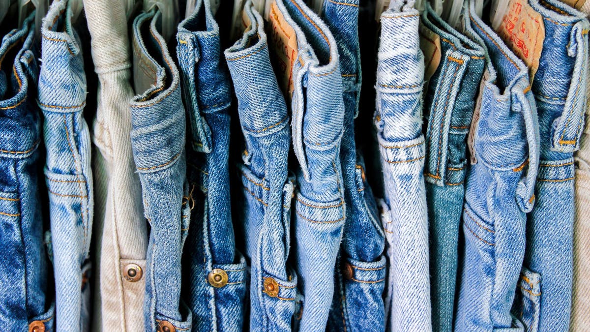 A rack of second hand jeans