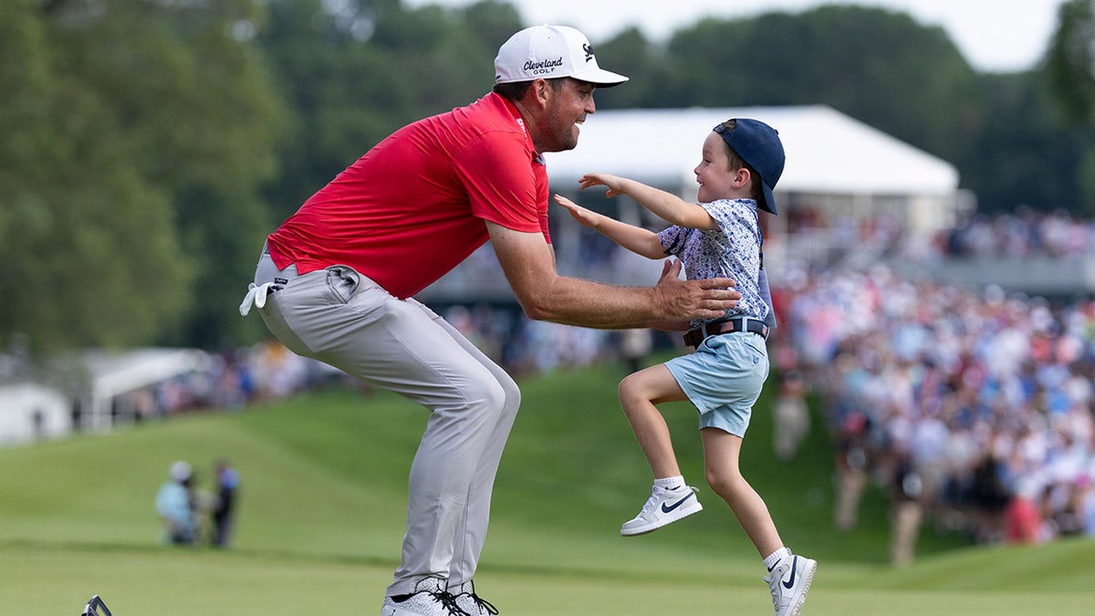 Keegan Bradley celebrates win with son