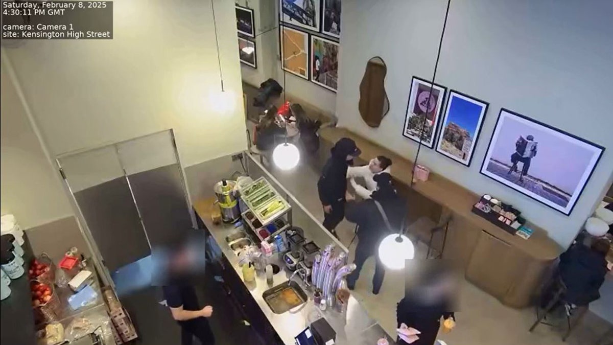 Genevieve Chenneour confronting her assailant in a London cafe in February.