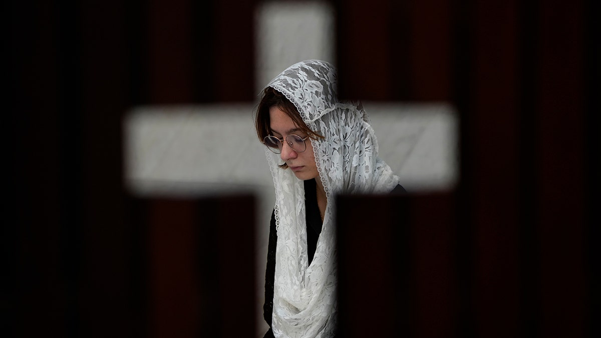 woman in cross window