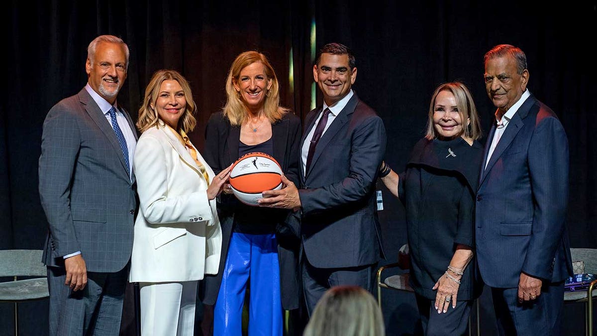 Cathy Engelbert poses with ball