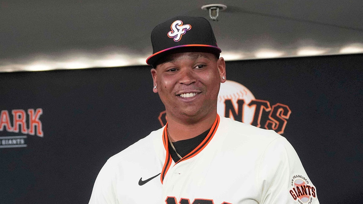 Rafael Devers wears Giants jersey