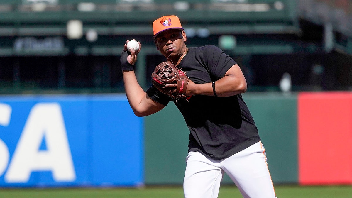 Rafael Devers throws ball