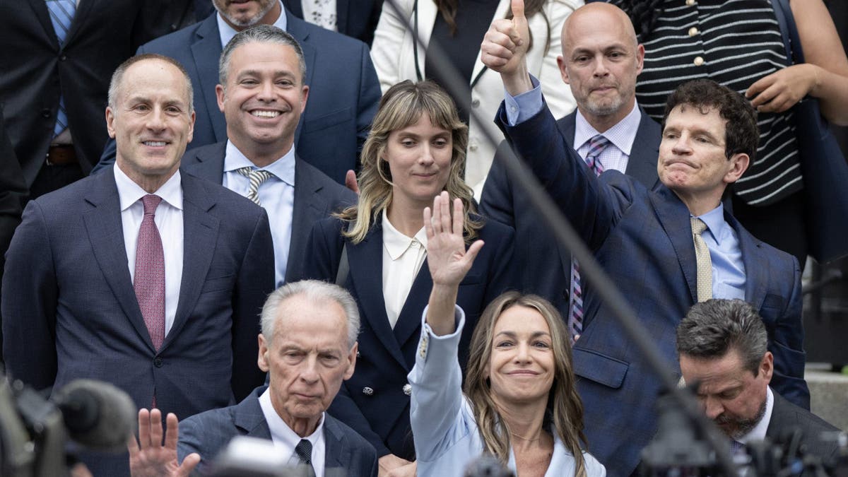 Read, her family and legal team greet supporters on the steps of the courthouse after her acquittal 