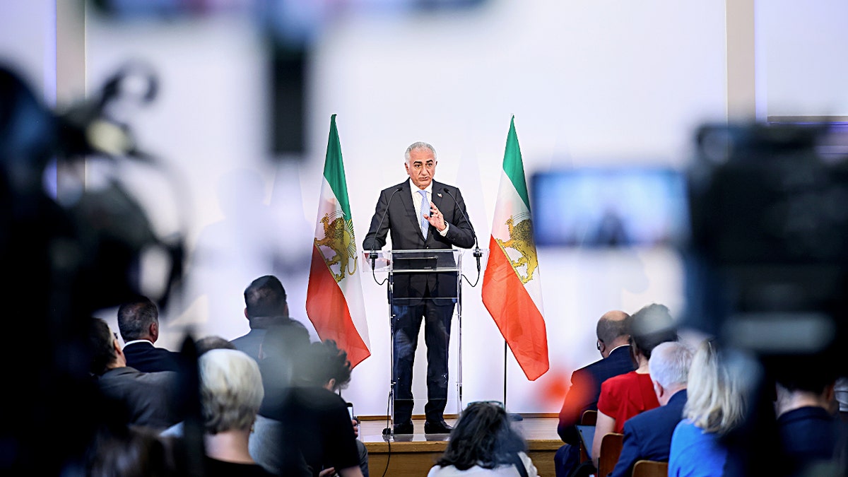 Reza Pahlavi on stage wide shot