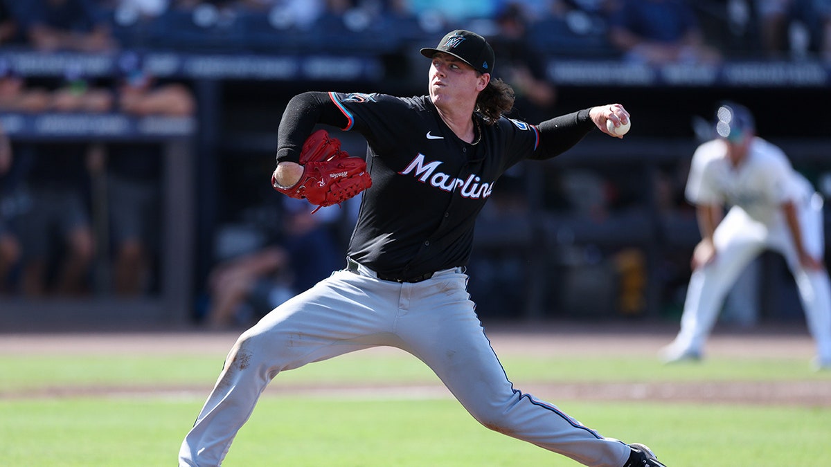 Ryan Weathers pitches
