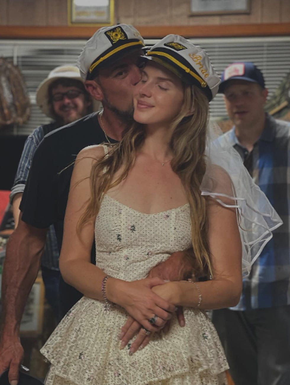 gathering featuring a woman in a dress and a nauticalthemed cap
