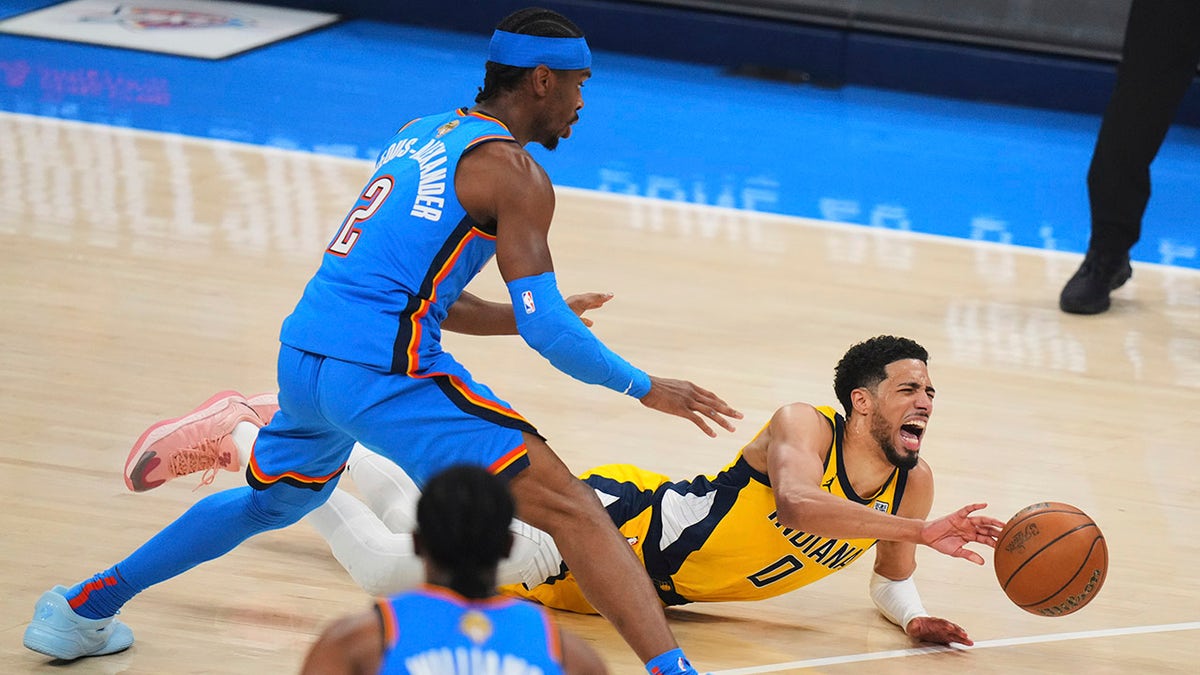 Tyrese Haliburton falls to the ground