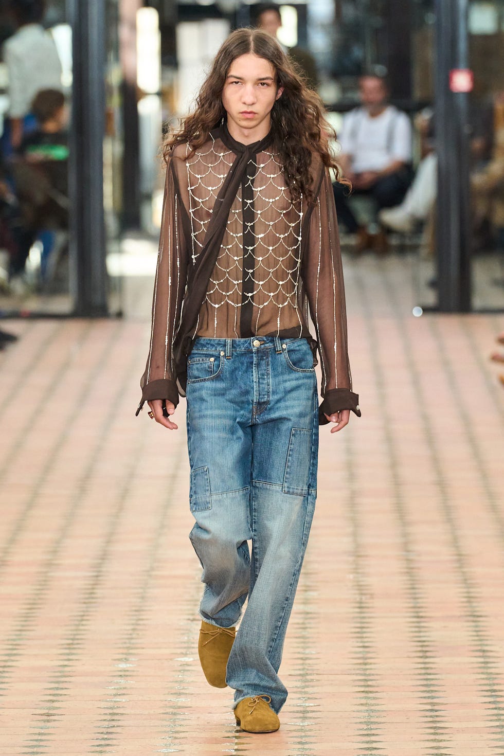 Fashion model showcasing a unique outfit on the runway