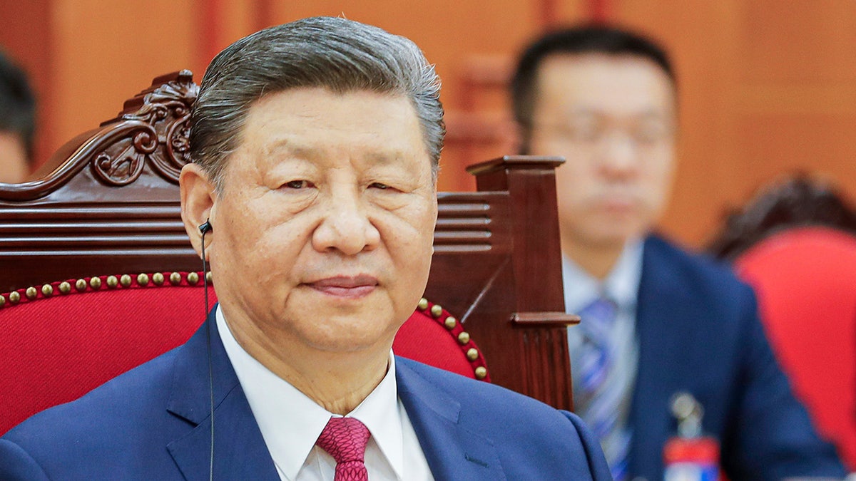Chinese President Xi Jinping listens as Vietnamese Prime Minister Pham Minh Chinh, not pictured, speaks during their meeting at the Office of the Party Central Committee in Hanoi, Vietnam, on Monday, April 14.