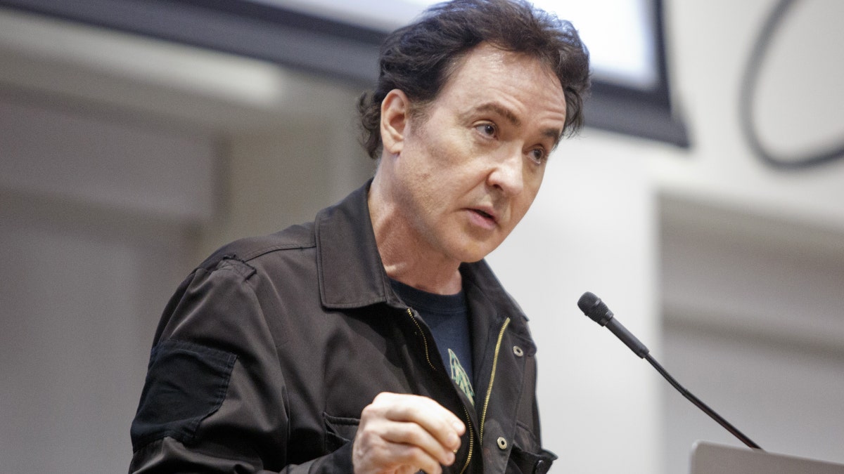 John Cusack at a speaking engagement