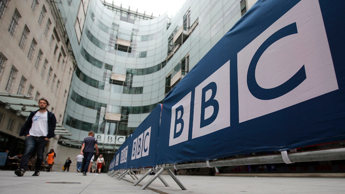 BBC workers place barriers near to the main entrance of the BBC headquarters and studios in Portland Place, London, Britain, July 16, 2015. Britain's newly-elected Conservative government suggested the BBC could become smaller and cheaper on Thursday in the opening salvo of a highly-charged battle for the future of the world's biggest public service broadcaster. Media Secretary John Whittingdale told parliament he would review whether the scale and scope of the BBC was still appropriate as part of a major study ahead of its 10-yearly Charter renewal in 2016. REUTERS/Peter Nicholls - RTX1KJ3J