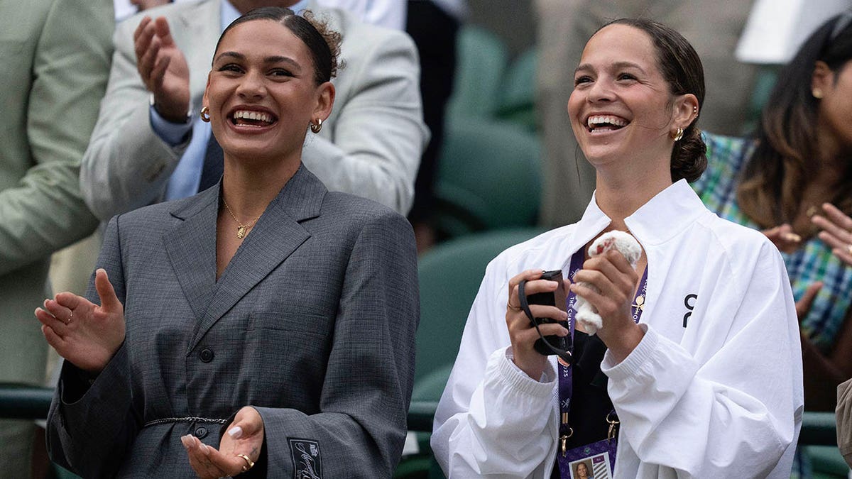 Trinity Rodman and Emma Shelton clap