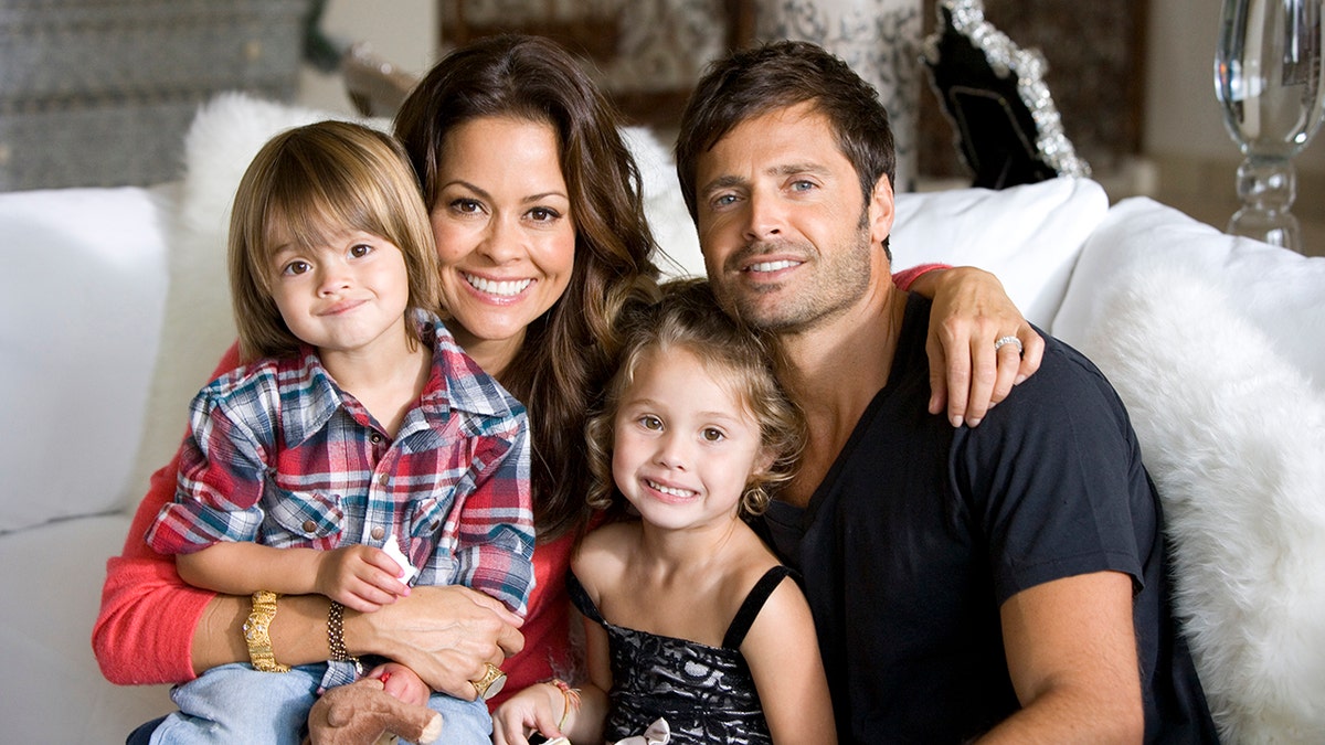 David Charvet posing with his then-wife Brooke Burke and their two young children.