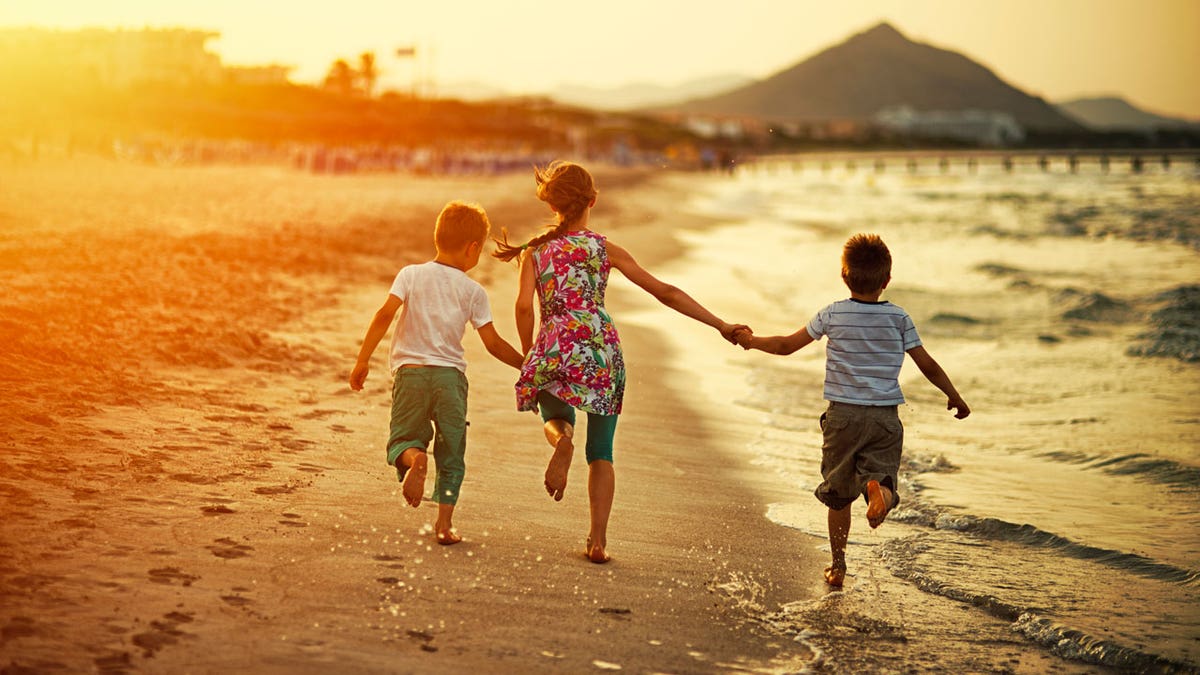 kids running on beach