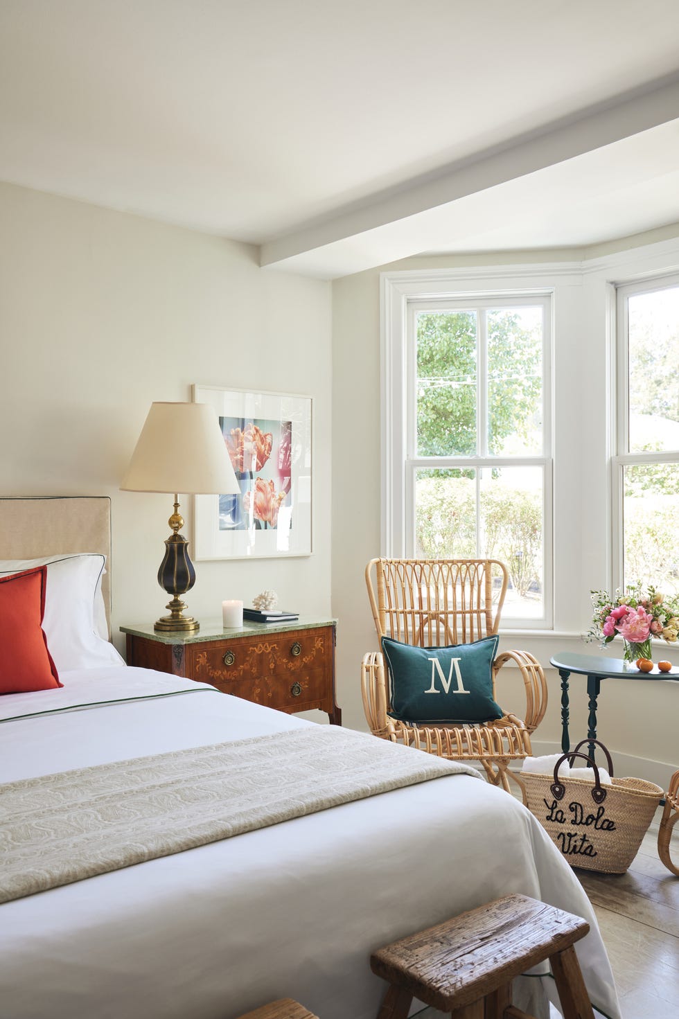 a bedroom with a bed and a chair