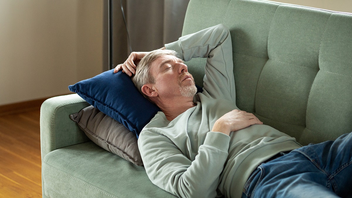 Sleeping man on couch