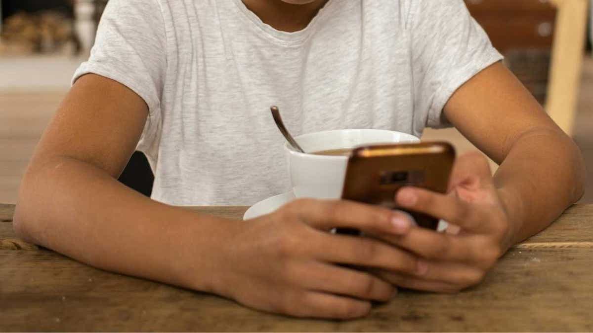 Illustration of a kid using Meta AI on her phone