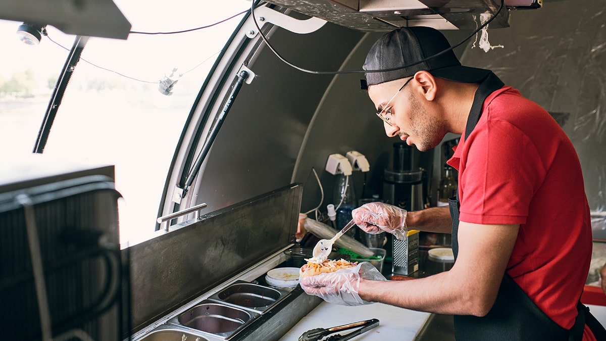 Food vendor preparing food