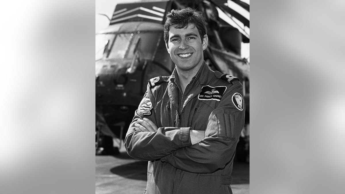 Prince Andrew in his pilot uniform smiling