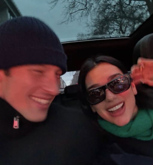 a group of individuals sitting in a vehicle